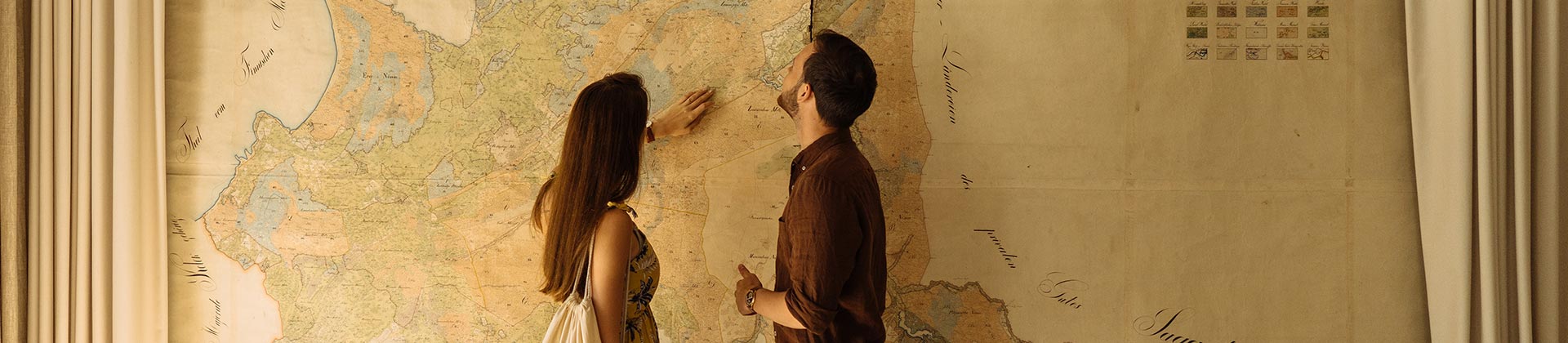 Couple in front of large map by Andri Peetso